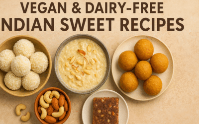 A variety of vegan and dairy-free Indian sweets including coconut ladoos, vegan kheer, besan ladoos, and date barfi, beautifully arranged on a beige background.